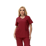 Anne V-neck Four-Pocket Scrub Top featuring a unique cross design and functional pockets.